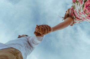 couple holding hands and going through life together